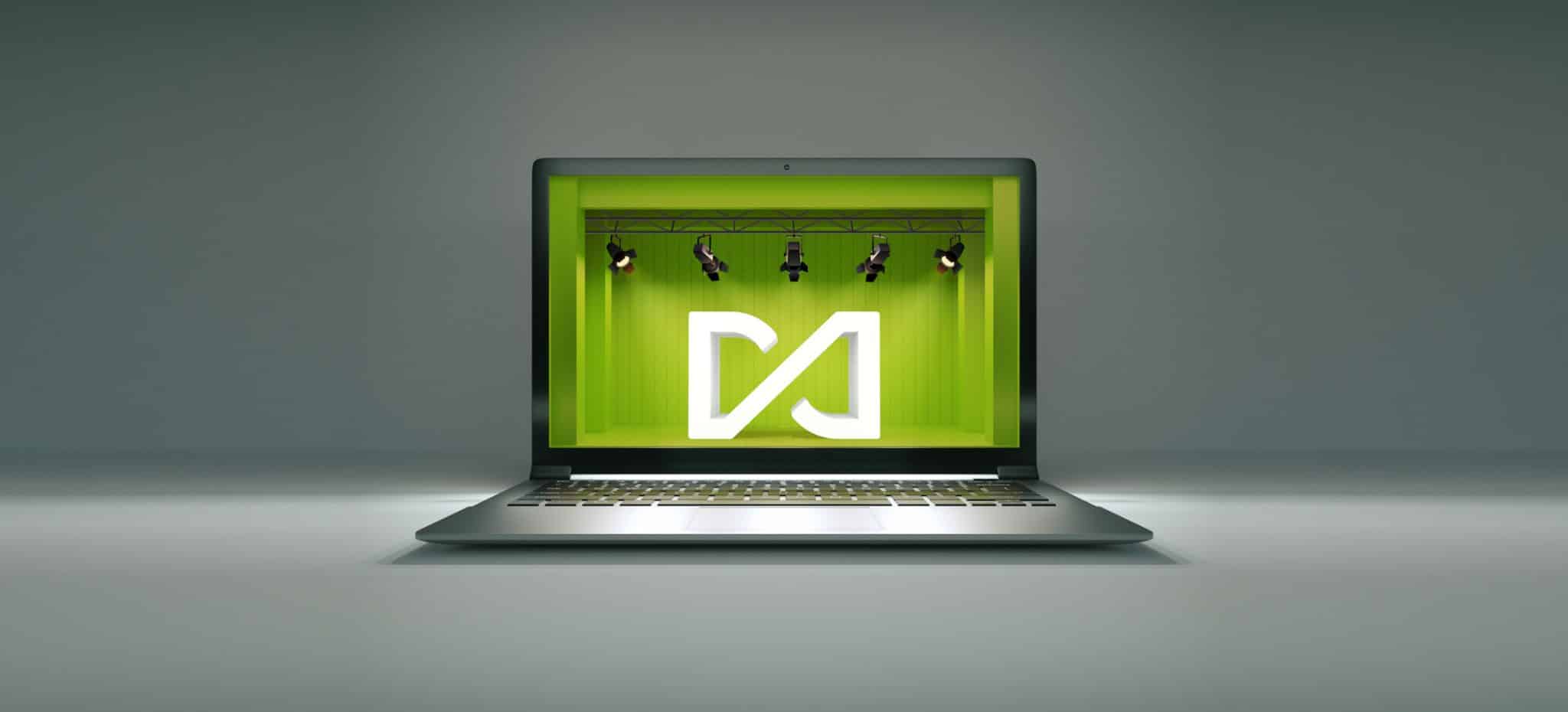 Diamond asset logo on a stage as reflected in the screen of a laptop